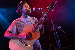Josephine plays acoustic guitar and also sings